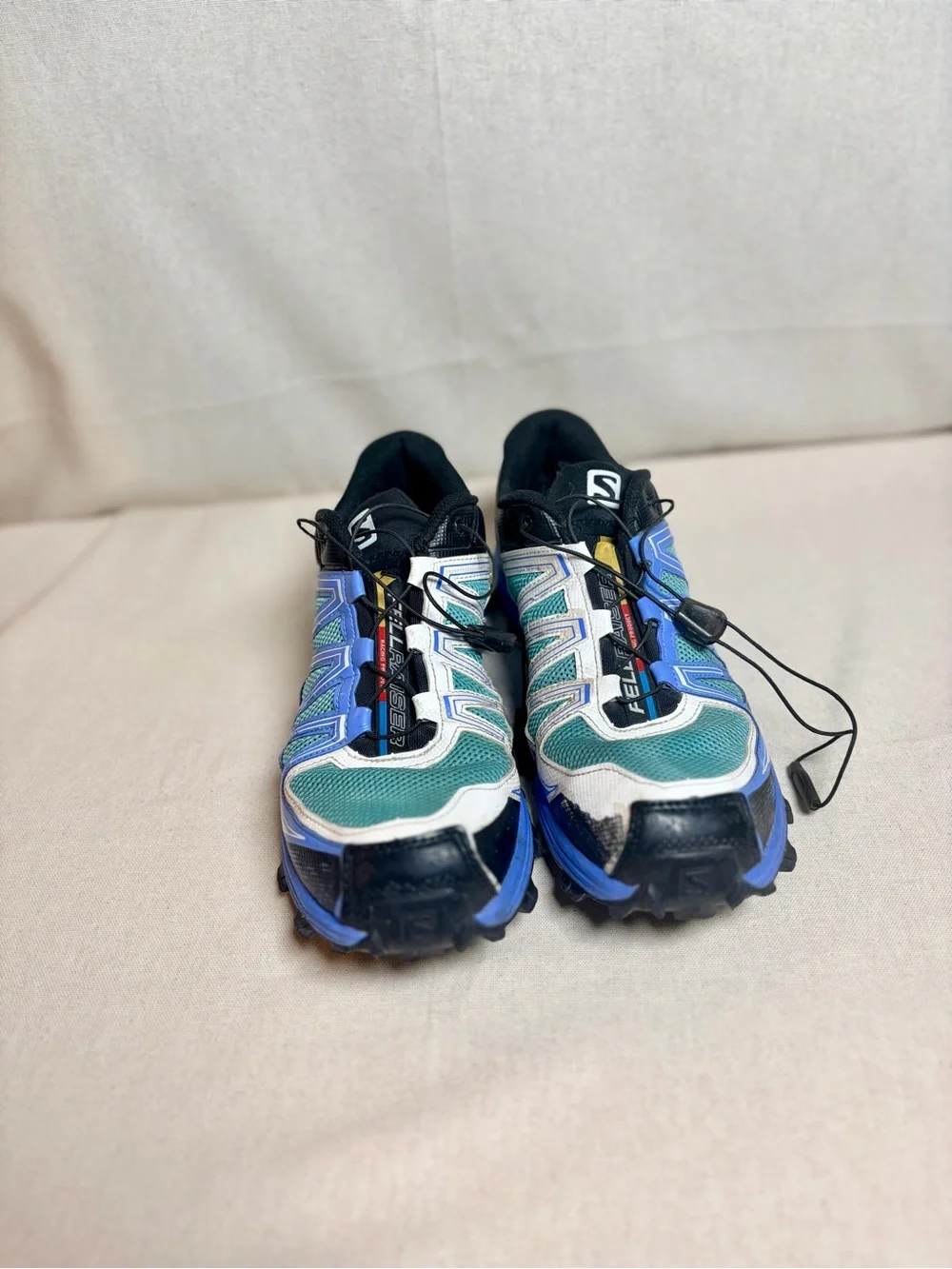 Salomon woman’s Sneakers in Teal, Blue, White and Black size 10
